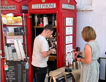 Red telephone call box used as micro-coffee shop